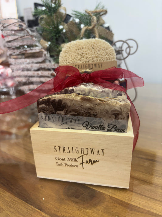 Wooden box with a red ribbon and 'Straightway Farms' branding on a wooden surface.